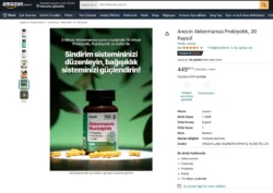 Avrupa projeleri için parlatılmış, dağınık sarı kapsüller içeren yeşil etiketli probiyotik şişesinin stüdyo çekimi ürün fotoğrafı.